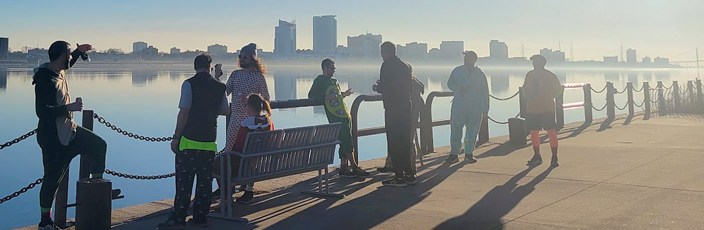 Photo of members of a Detroit area social running club along the Detroit River