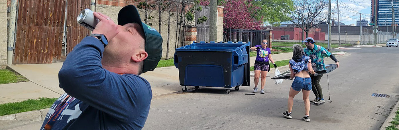 Photo of members of a Detroit area social running club picking up trash