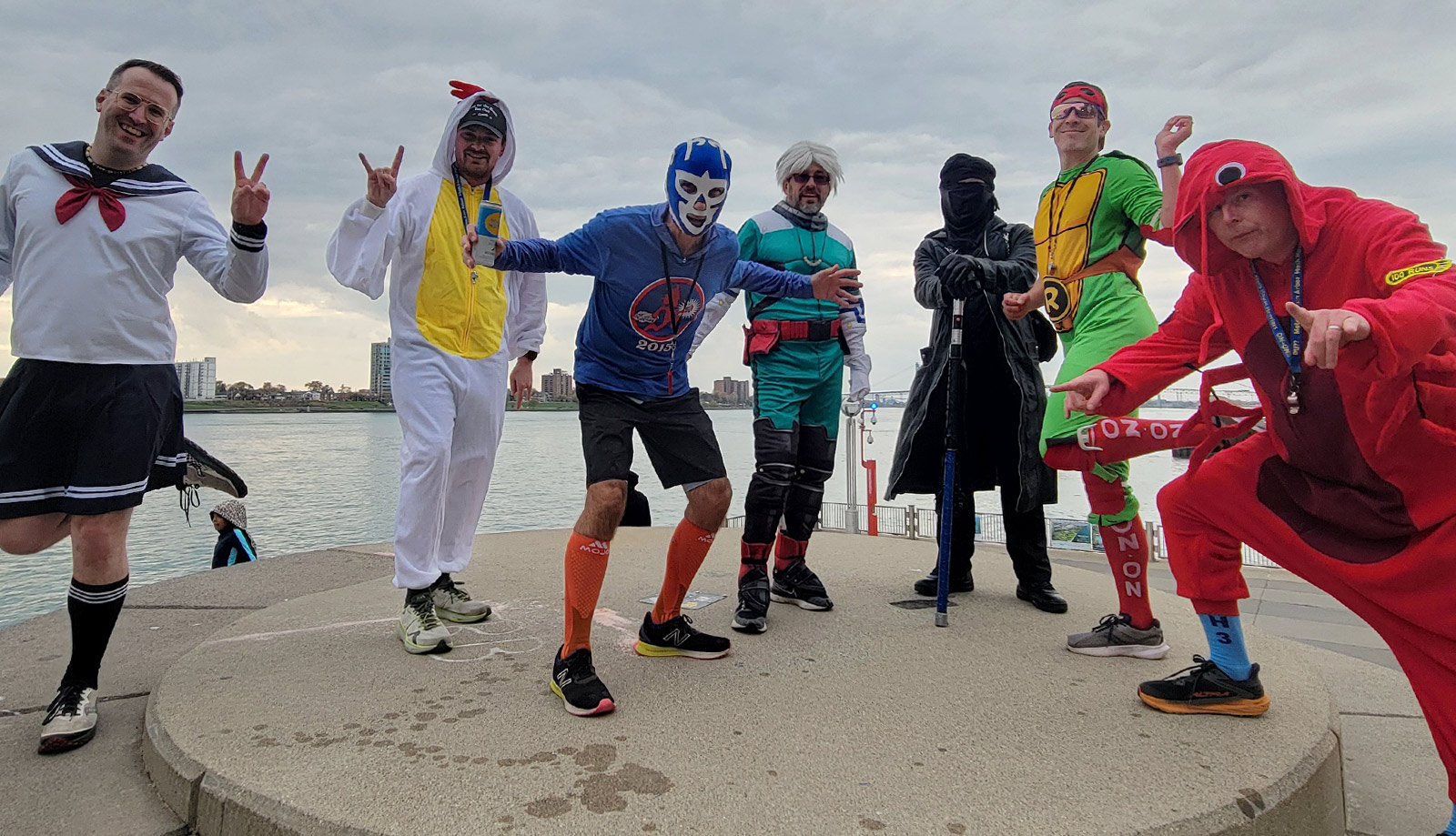 Members of a Detroit area social running club pausing for a quick drink and photo op in downtown Detroit while dressed in costumes