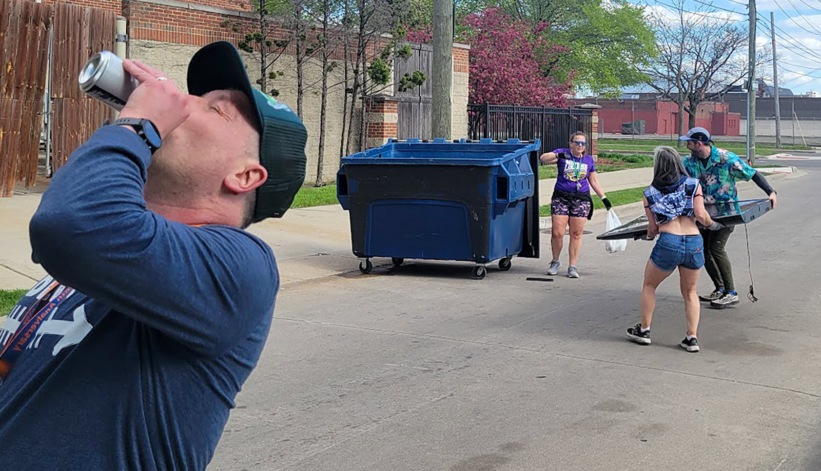 Photo of members of a Detroit area social running club picking up trash